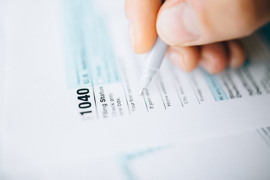 Person Filing Tax Documents Free Stock Photo