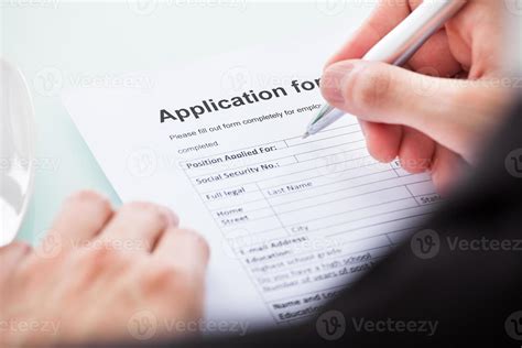 Person Filling Out A Form By Hand 907392 Stock Photo At Vecteezy