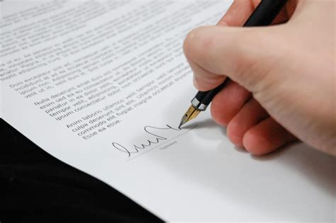 Person Signing Paperwork