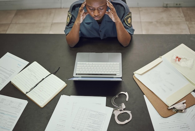 Police Woman And Working With Stress At Desk With Documents Paperwork Or Frustrated With