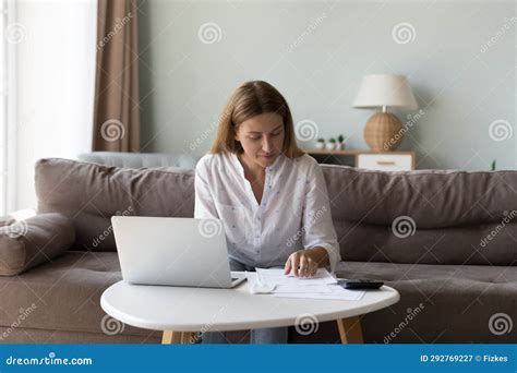 Positive Caucasian Millennial Woman Doing Domestic Paperwork At Home