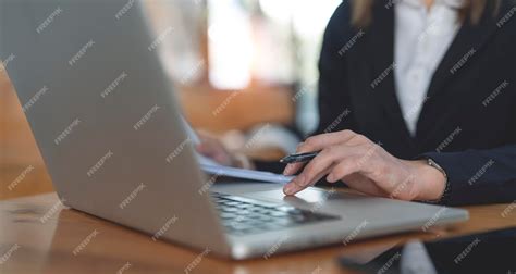 Premium Photo Businesswoman Hand Is On Laptop Trackpad Working On