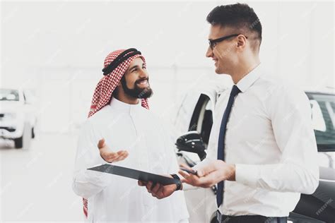 Premium Photo Happy Customer Salesman Holds Car Loan Papers