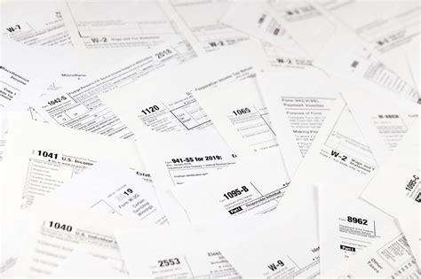 Premium Photo Many Tax Form Blanks Lies On Table Tax Payers Paperwork