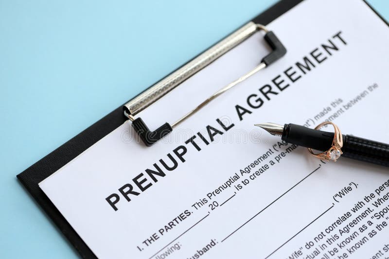 Prenuptial Agreement And Wedding Ring On Table Premarital Paperwork Process In Usa Close Up