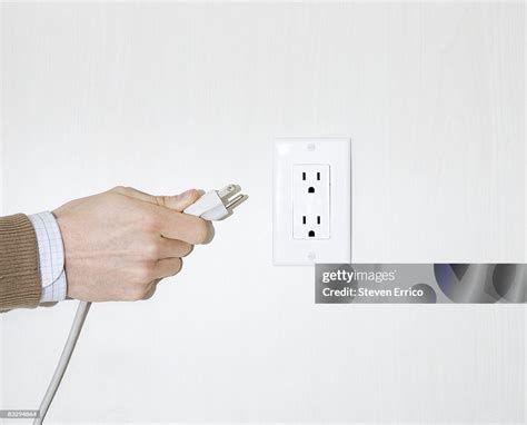 Pulling Plug Out Of Wall Photos And Premium High Res Pictures Getty