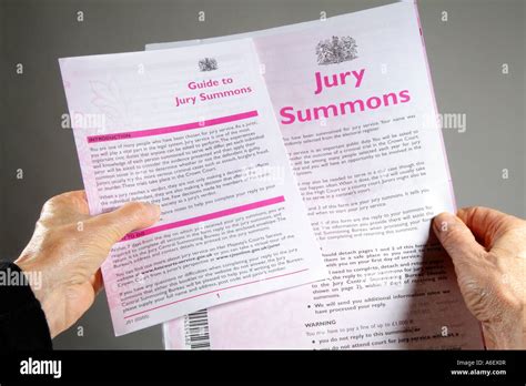 Reading A Jury Service Summons Paperwork And Guide Stock Photo Alamy