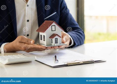 Real Estate Offices Home Sales Agents Work On Paperwork And Calculate Interest Taxes And