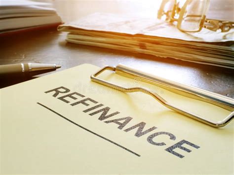 Refinance Concept Stack Of Business Documents On Table Stock Image