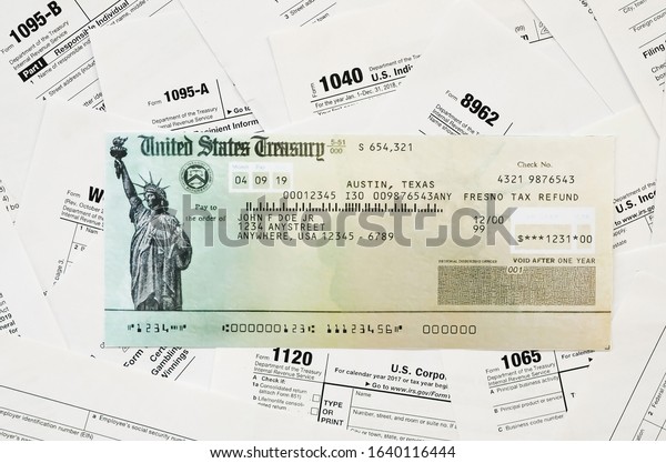 Refund Check On Many Tax Form Stock Photo Edit Now 1640116444