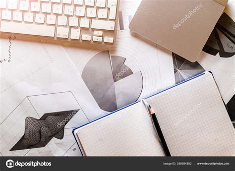 Reviewing Paperwork Charts Graphs Diagrams On Table Stock Photo