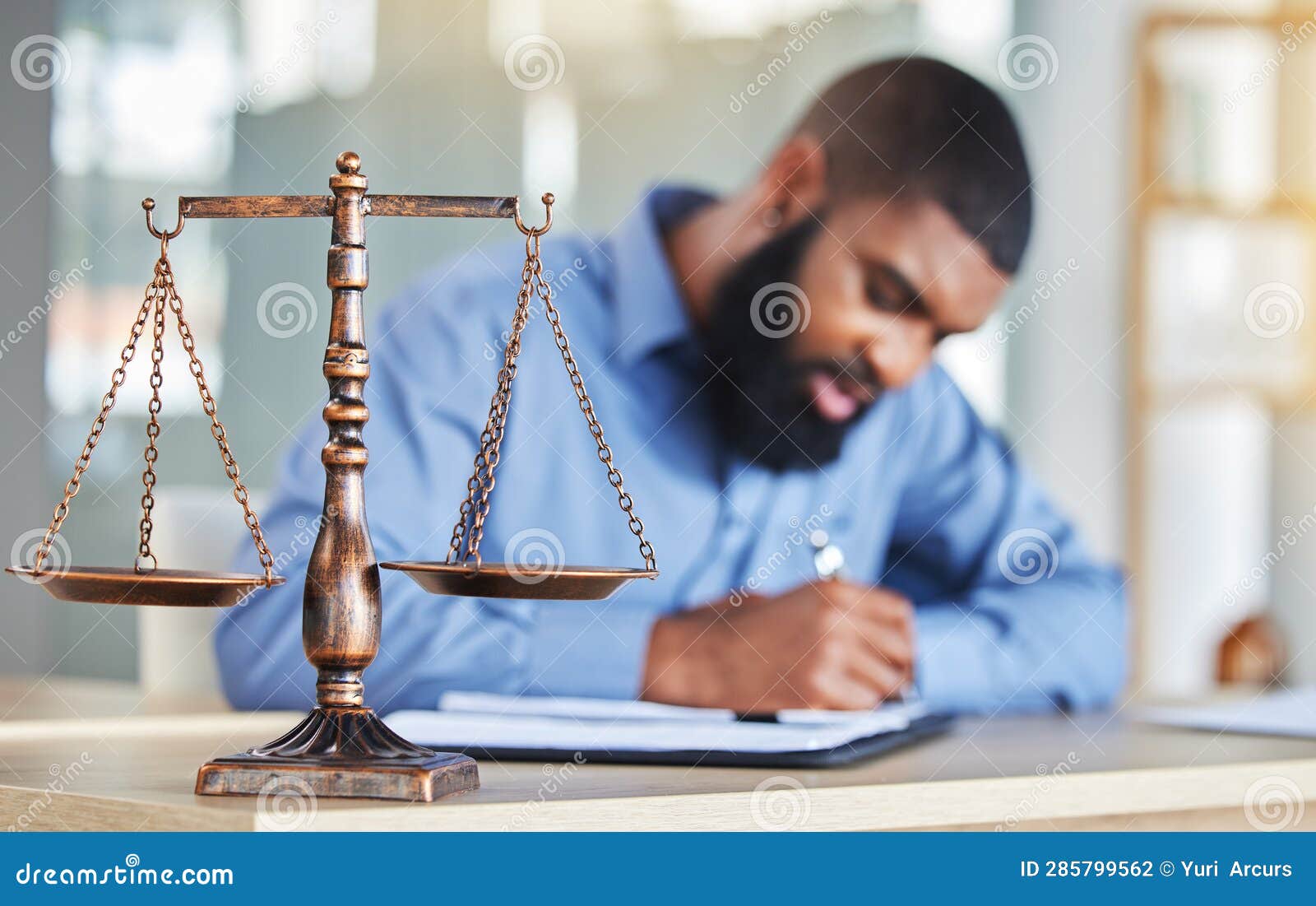 Scale Notes And Black Man In Office Lawyer Or Judge At Desk With Paperwork Research Or Crime Report Justice Icon And Attorney At Law Firm Writing In Notebook Legal Administration And Contract