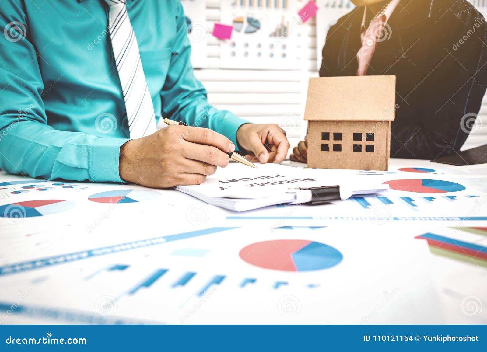 Signing Of Paper Work Home Buying With Broker And Buyer Stock Photo