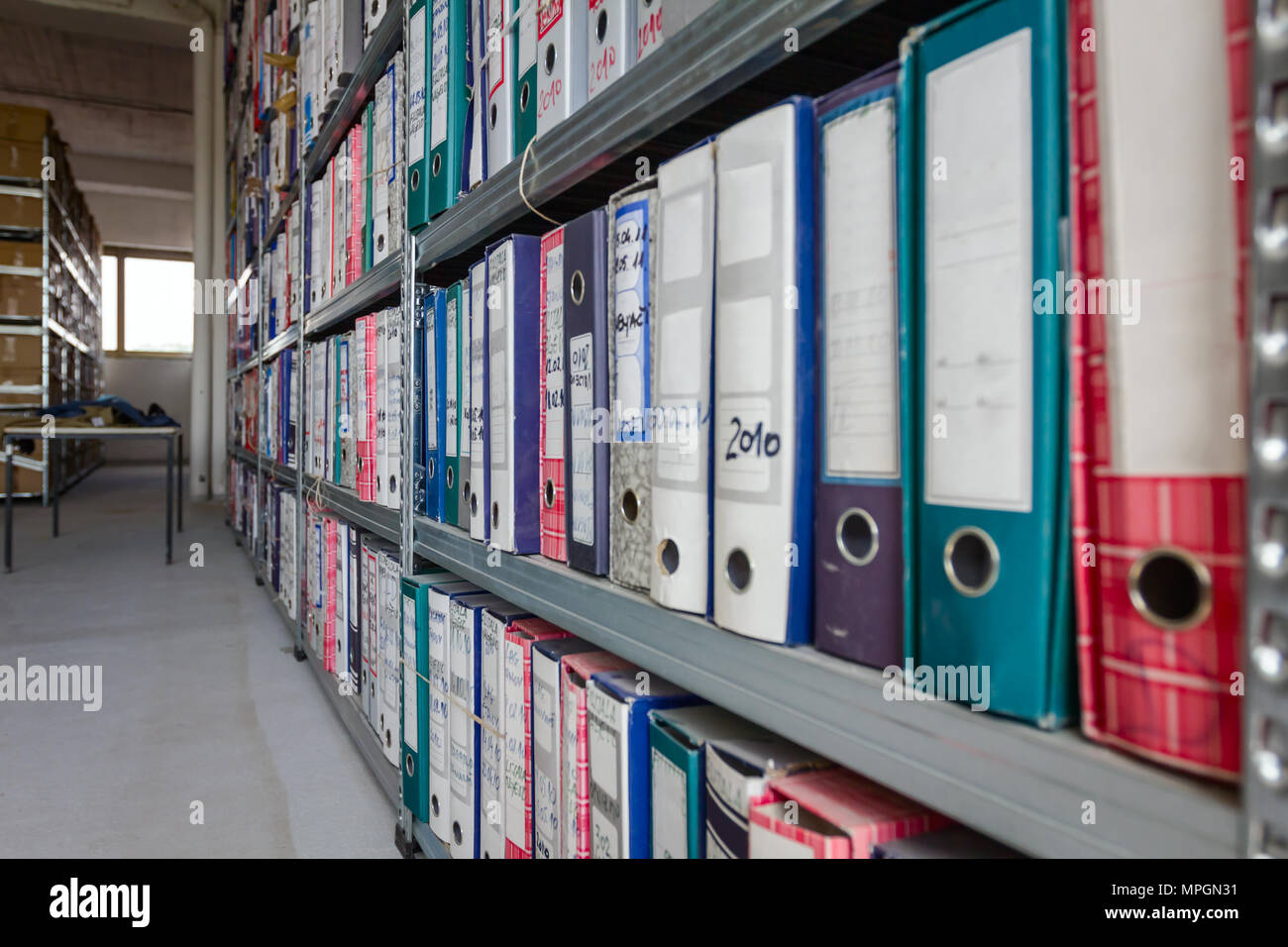 Stacks Of Files And Paperwork Placed In Bookshelves With Folders And Documents In Binders