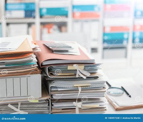 Stacks Of Paperwork In Overflowing Cupboard Stock Photography