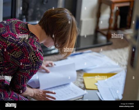 Student Sorting Assignment Paperwork For Submission Stock Photo Alamy