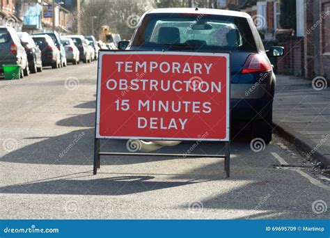 Temporary Obstruction 15 Minutes Delay Sign On Residential Road Stock