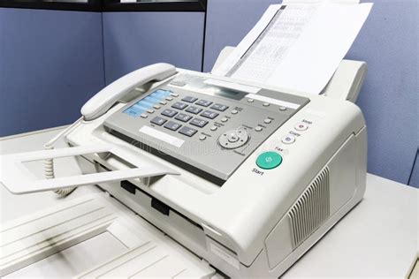 The Fax Machine For Sending Documents In The Office Stock Photo