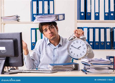 The Overloaded Busy Employee With Too Much Work And Paperwork Stock Photo Image Of Overworked