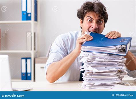 The Overloaded Busy Employee With Too Much Work And Paperwork Stock