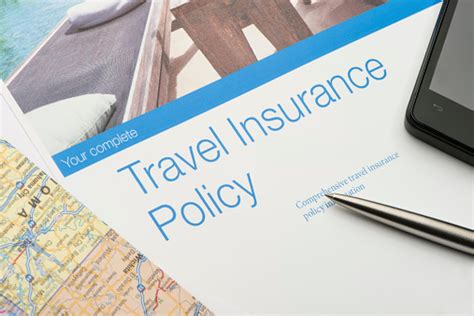 Travel Insurance Policy Document With Paperwork And Technology Stock Photo Download Image Now