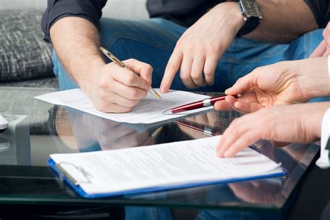 Two People Signing A Document Texas Divorce Lawyers