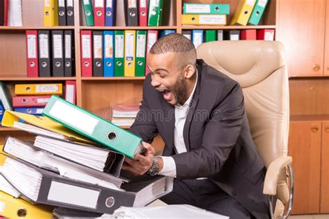 Unhappy Man With A Lot Of Paperwork Stock Photo Image Of Evening Businessman 65451030