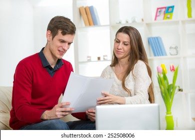 View Of An Attractive Couple Doing Administrative Paperwork Stock Photo