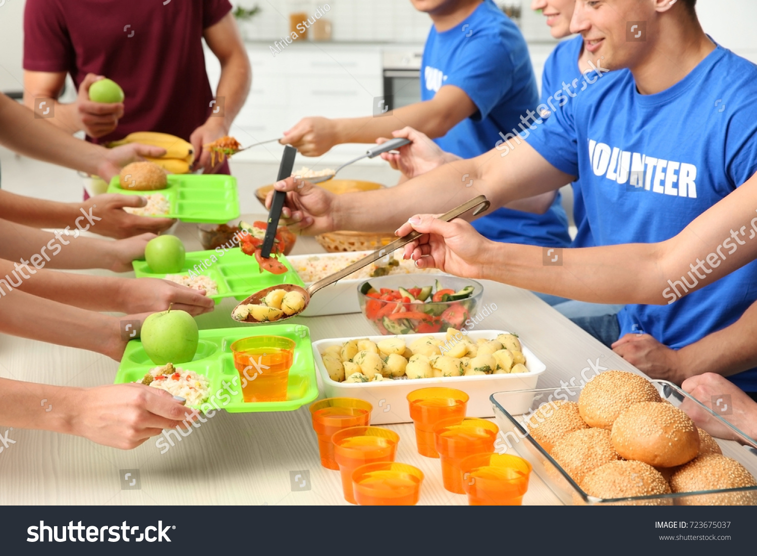 Volunteers Serving Food Homeless People Indoors Stock Photo Edit Now