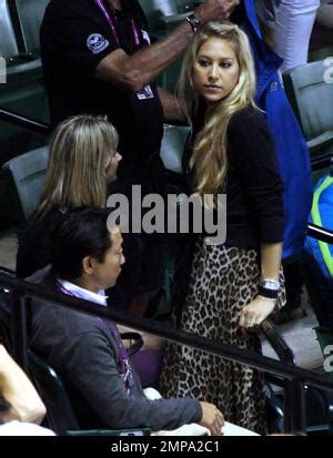 Wearing A Black Top And Flowing Leopard Patterned Skirt Tennis Star Anna Kournikova Chats With