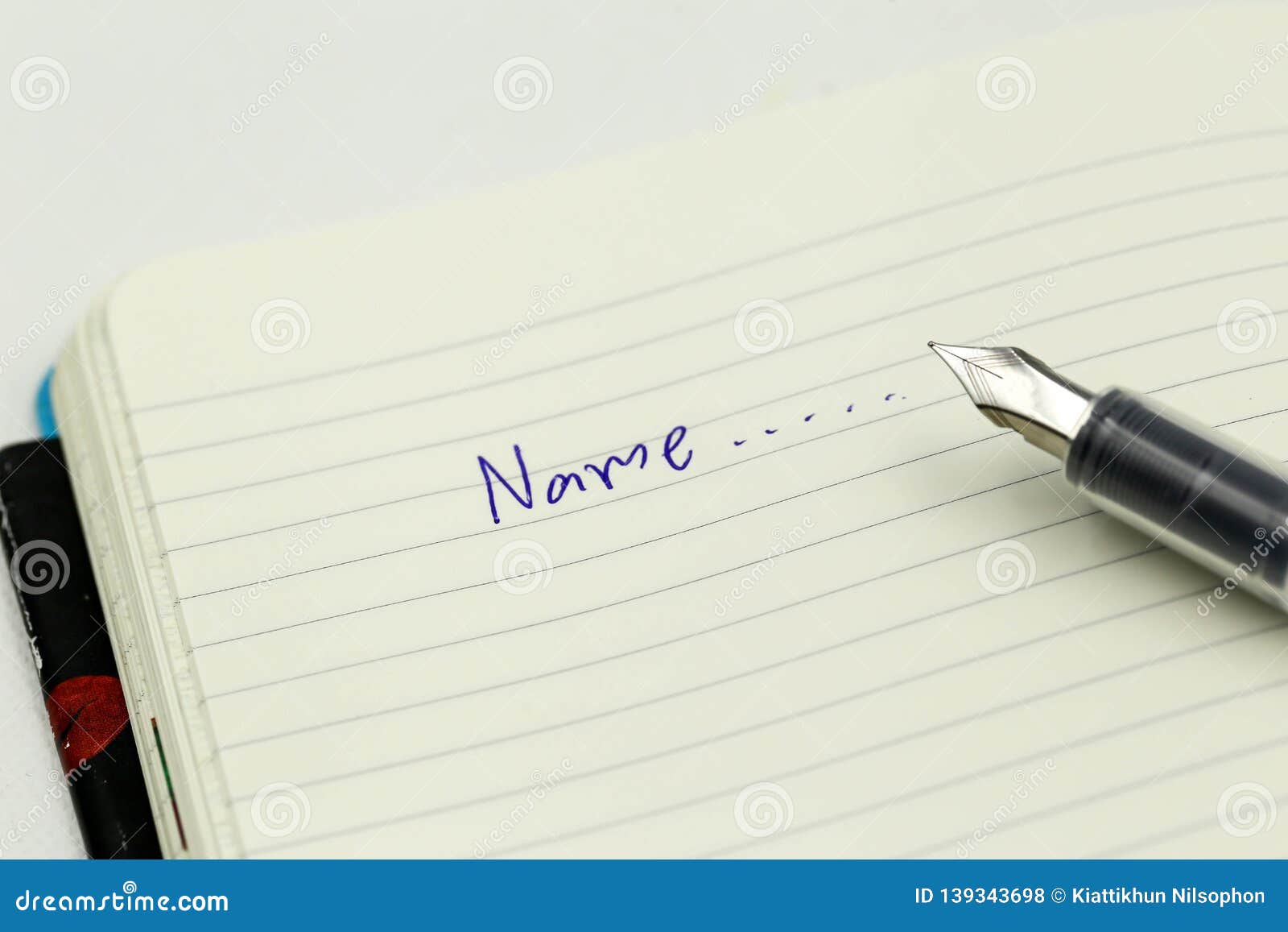 Writing The Name On A Paper With A Pen Using For Concept Of Namesake